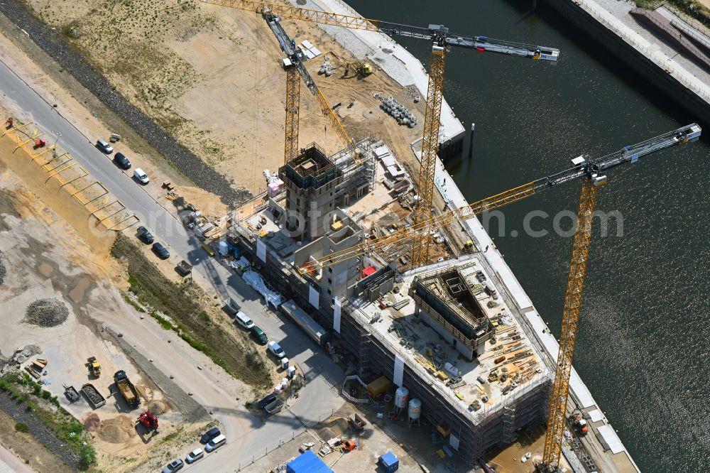 Hamburg from above - Construction site for new high-rise building complex Roots on street Versmannstrasse - Lucy-Borchardt-Strasse on Baakenhafen in the district HafenCity in Hamburg, Germany