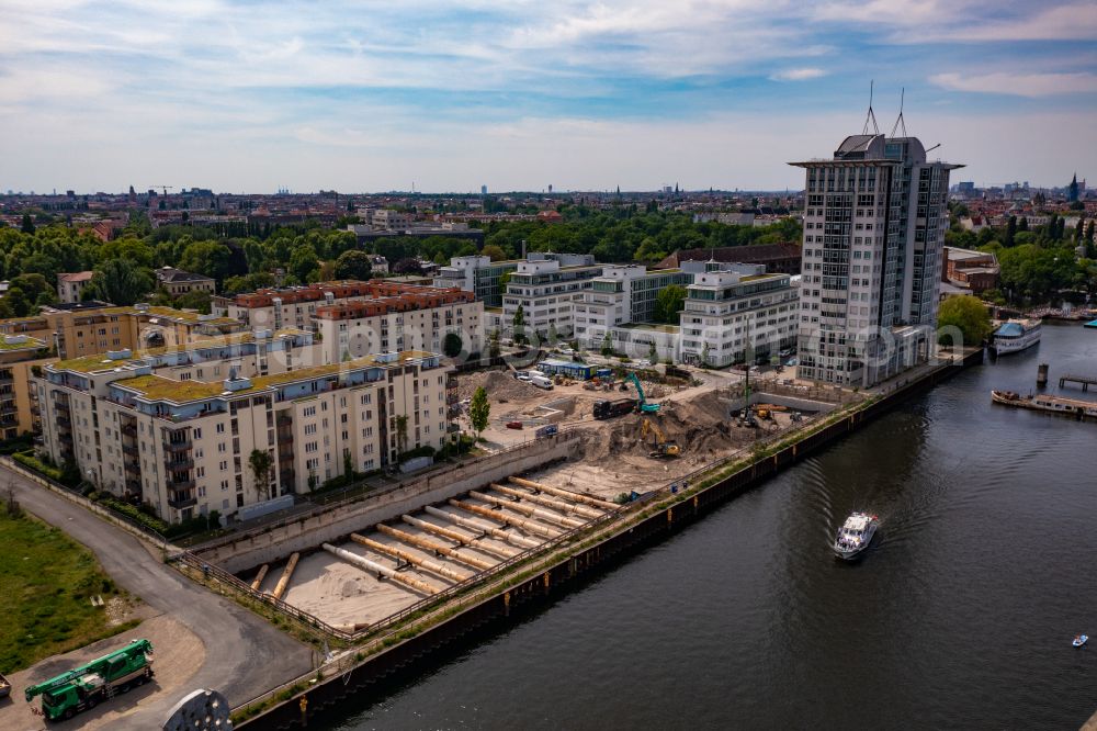Berlin from the bird's eye view: Construction site for new high-rise building complex on river site of Spree along the Fanny-Zobel-Strasse in the district Treptow in Berlin, Germany