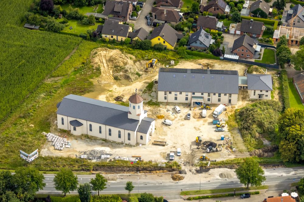 Ahlen from the bird's eye view: Construction site for the new building of the church building of the St. Georgkirche and Gemeindezentrum St. Georg on street Paul-Gerhardt-Strasse in Ahlen in the state North Rhine-Westphalia, Germany