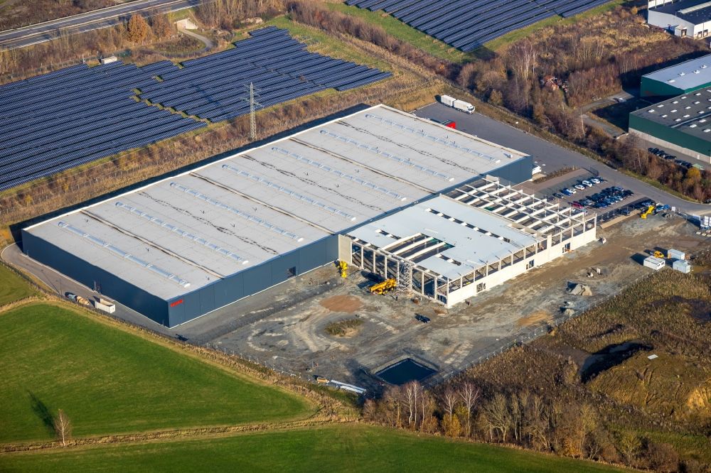 Meschede from above - Construction site to build a new building complex on the site of the logistics center of Briloner Leuchten GmbH & Co. KG Am Steinbach in Meschede at Sauerland in the state North Rhine-Westphalia, Germany