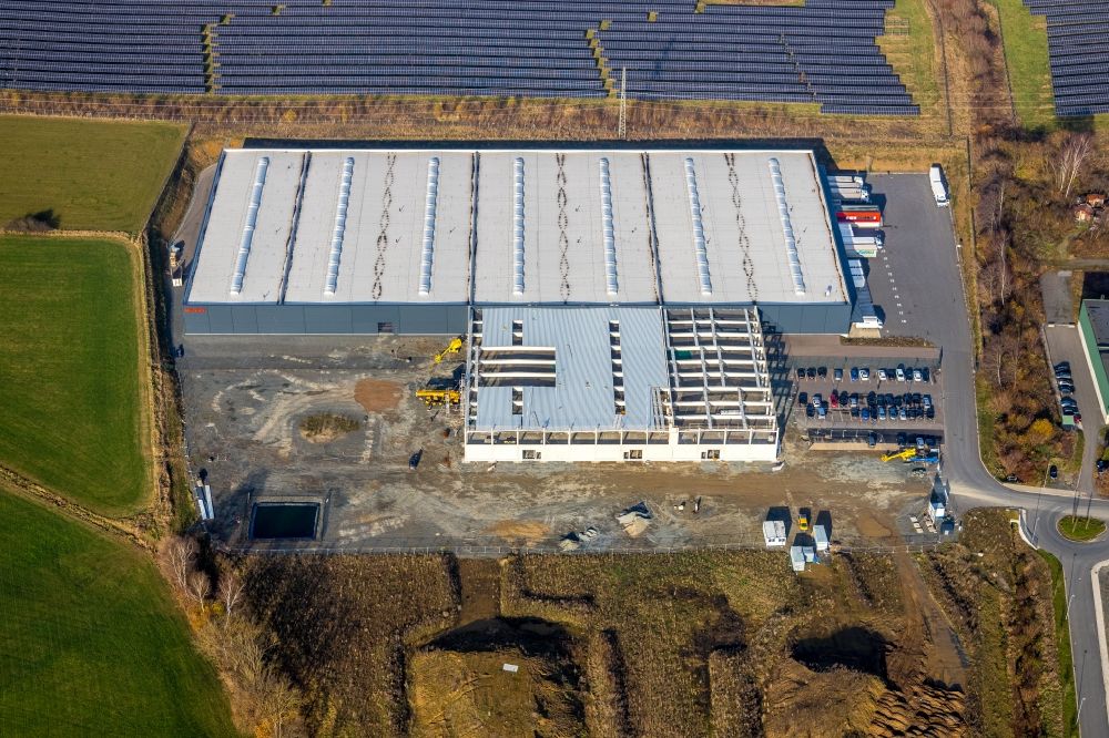 Meschede from the bird's eye view: Construction site to build a new building complex on the site of the logistics center of Briloner Leuchten GmbH & Co. KG Am Steinbach in Meschede at Sauerland in the state North Rhine-Westphalia, Germany