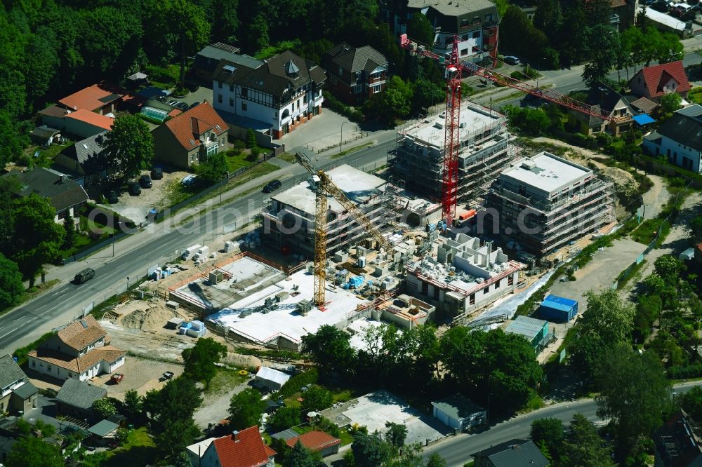 Stahnsdorf from the bird's eye view: Construction site for the construction of an apartment building Baeke-Quartier on Wilhelm-Kuelz-Strasse in Stahnsdorf in the state of Brandenburg, Germany
