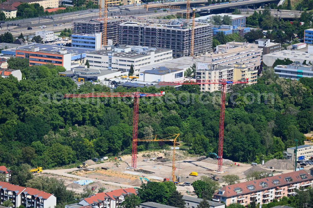 Berlin from the bird's eye view: Construction site to build a new multi-family residential complex on Buschkrugallee in the district Britz in Berlin, Germany