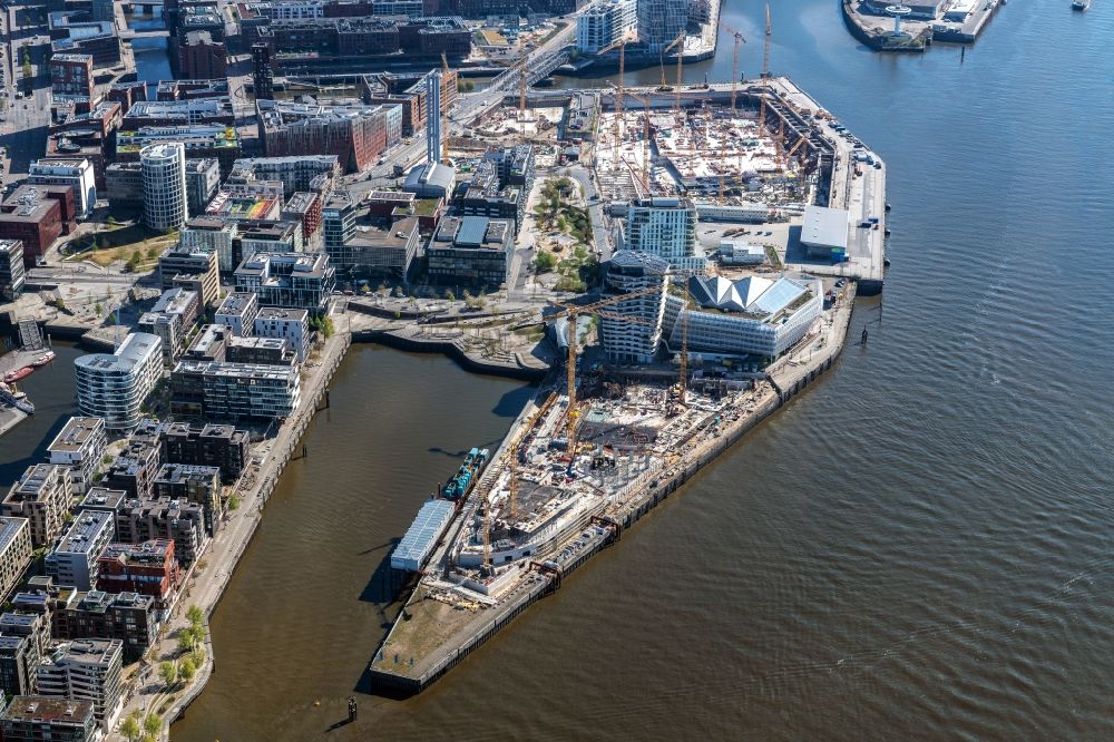 Hamburg from the bird's eye view: Construction site to build a new multi-family residential complex of DC DEVELOPMENTS GMBH & CO. KG on Strandkai in the district HafenCity in Hamburg, Germany