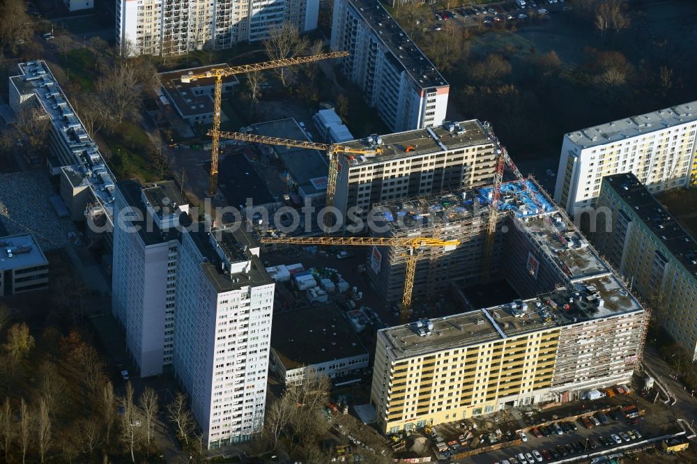Berlin from above - Construction site to build a new multi-family residential complex Dolgensee-Center on Dolgenseestrasse in the district Lichtenberg in Berlin, Germany