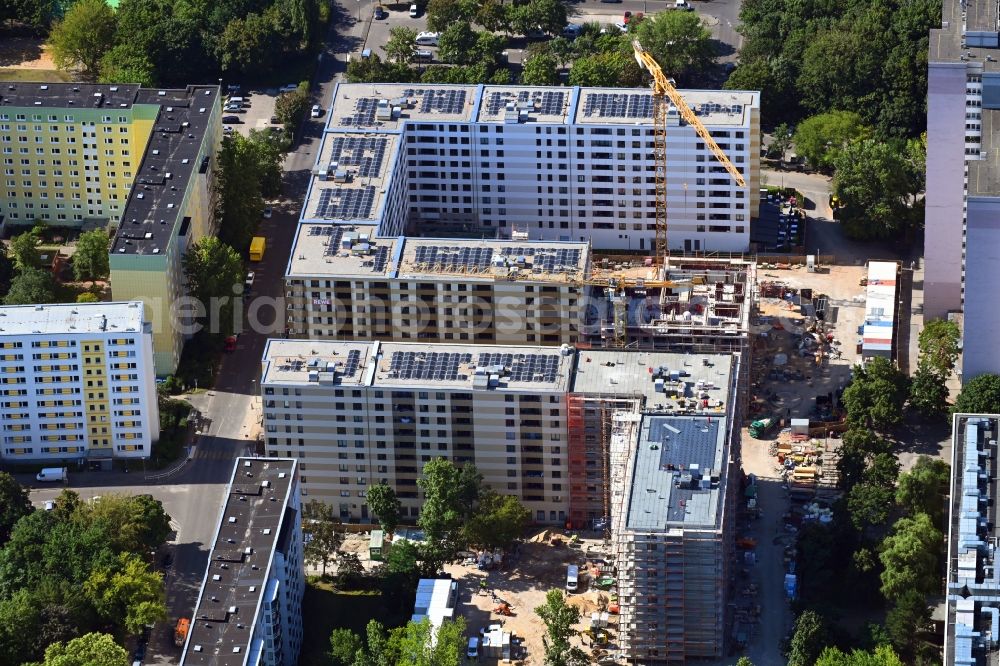 Berlin from the bird's eye view: Construction site to build a new multi-family residential complex Dolgensee-Center on Dolgenseestrasse in the district Lichtenberg in Berlin, Germany