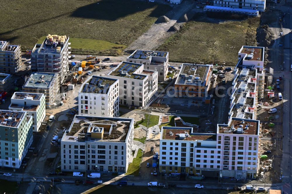 München from the bird's eye view: Construction site to build a new multi-family residential complex on Ellis-Kaut-Strasse - Golo-Mann-Weg - Albert-Camus-Strasse in the district Freiham in Munich in the state Bavaria, Germany