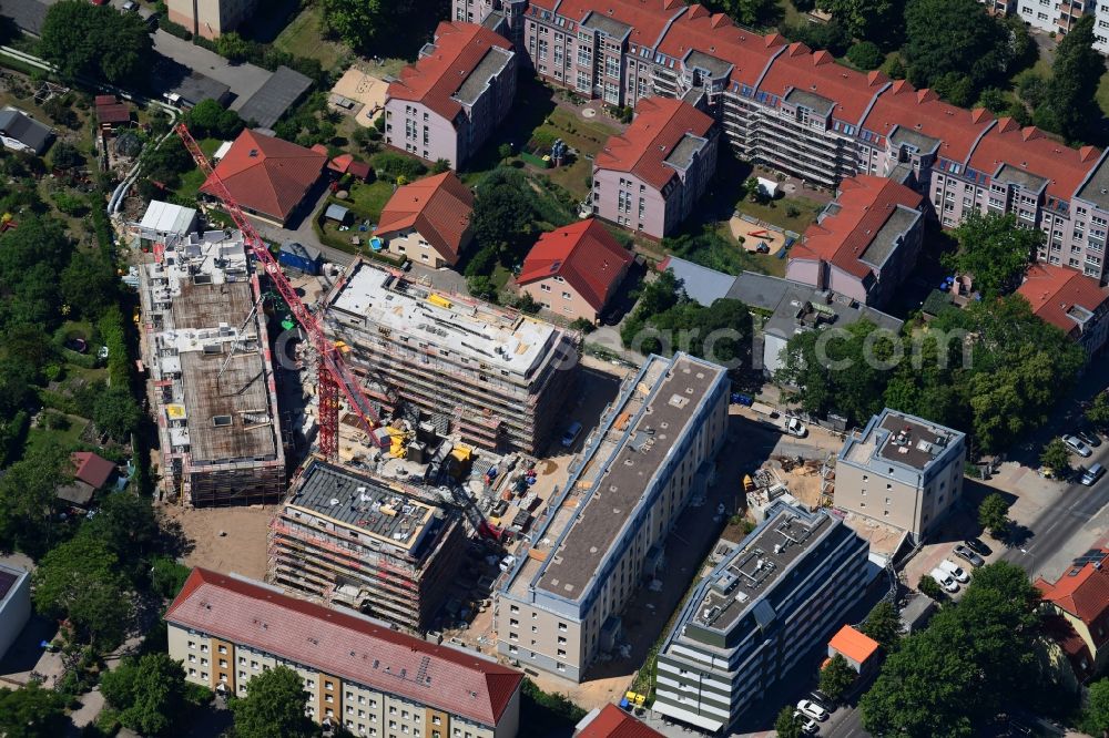 Berlin from the bird's eye view: Construction site to build a new multi-family residential complex along the Einbecker Strasse in the district Lichtenberg in Berlin, Germany