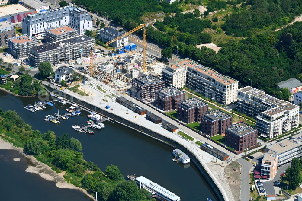 Dresden from the bird's eye view: Construction site to build a new multi-family residential complex HAFENCITY Dresden on Elberadweg in Dresden in the state Saxony, Germany