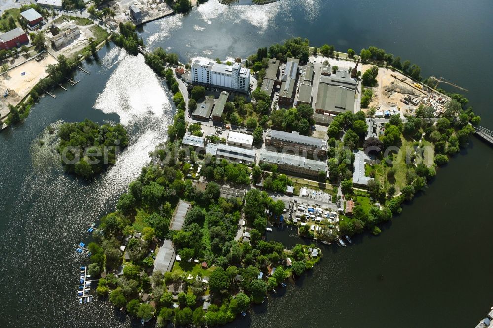 Berlin from the bird's eye view: Construction site for the construction of an apartment building on the Havel island of Eiswerder in the district of Hakenfelde in Berlin, Germany