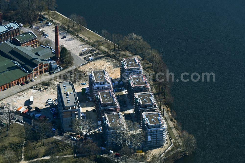 Berlin from the bird's eye view: Construction site for the construction of an apartment building on the Havel island of Eiswerder in the district of Spandau Hakenfelde in Berlin, Germany