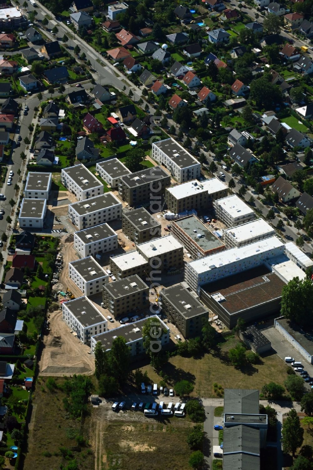 Berlin from above - Construction site to build a new multi-family residential complex of Johannisgaerten between of Strasse am Flugplatz and Melli-Beese-Strasse in the district Johannisthal in Berlin, Germany