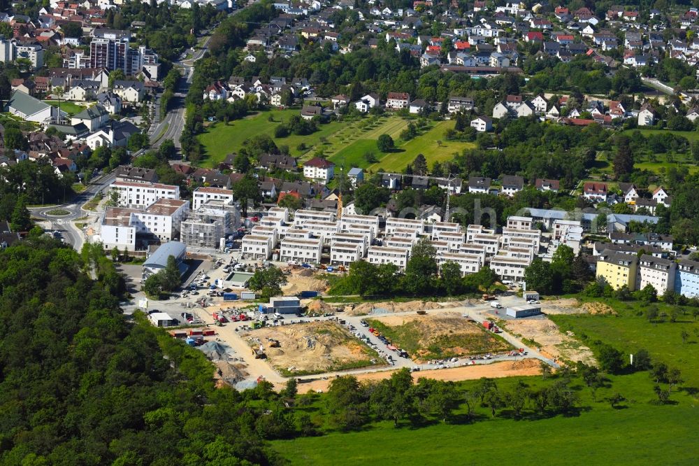 Friedrichsdorf from the bird's eye view: Construction site to build a new multi-family residential complex OekoSiedlung between Plantation and Pettenweiler Holzweg in the district Dillingen in Friedrichsdorf in the state Hesse, Germany
