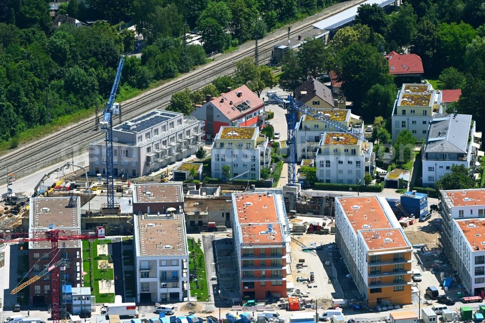 München from the bird's eye view: Construction site to build a new multi-family residential complex Marianne-Hoppe-Strasse - Henschelstrasse - Federseestrasse in the district Lochhausen in Munich in the state Bavaria, Germany