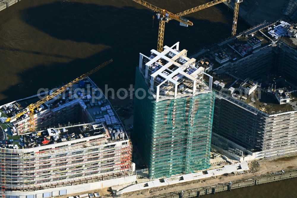 Hamburg from above - Construction site to build a new multi-family residential complex of DC DEVELOPMENTS GMBH & CO. KG on Strandkai along the Nordelbe in the district HafenCity in Hamburg, Germany