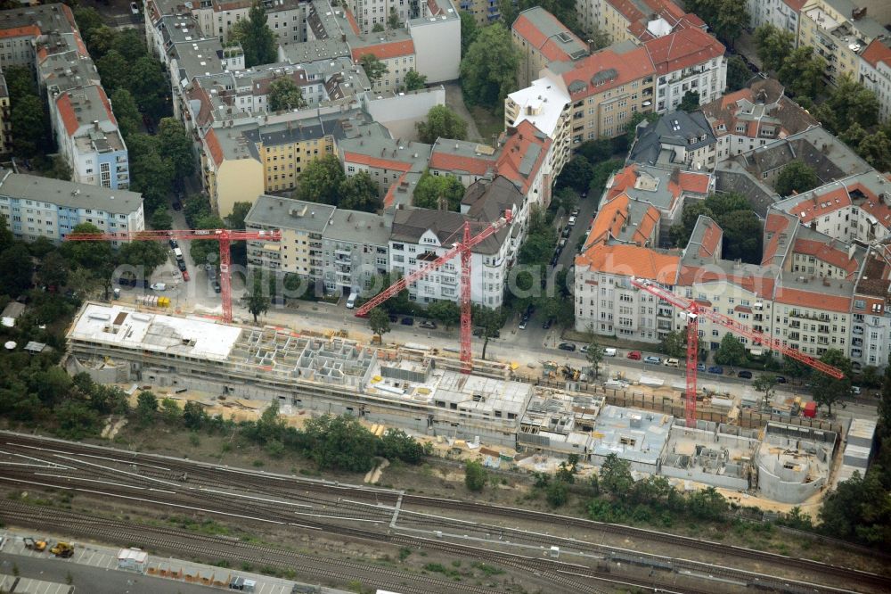 Aerial photograph Berlin - Construction site to build a new multi-family residential complex in the Halensee part of the district of Charlottenburg-Wilmersdorf in Berlin in Germany. The construction site is located on Seesener Strasse, on railway tracks. A modern residential complex with business areas is being created