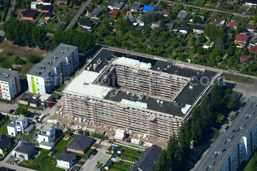 Berlin from above - Construction site to build a new multi-family residential complex Wartenberger Strasse - Anna-Ebermonn-Strasse in the district Hohenschoenhausen in Berlin, Germany