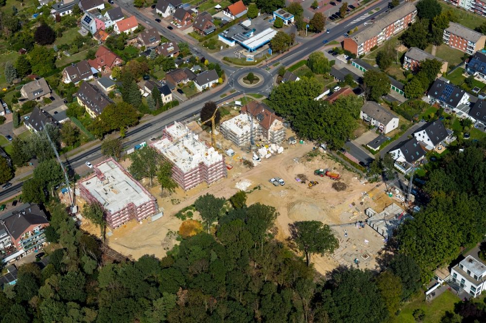 Aerial photograph Voerde (Niederrhein) - Construction site to build a new multi-family residential complex Pestalozziquartier on Alexanderstrasse - Bahnhofstrasse in Voerde (Niederrhein) in the state North Rhine-Westphalia, Germany