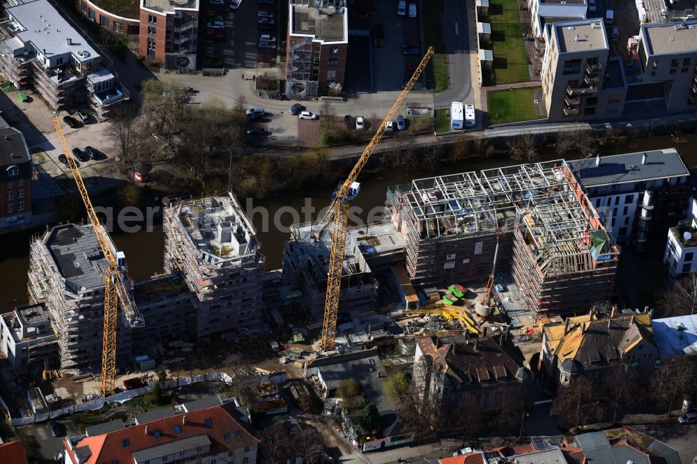 Leipzig from the bird's eye view: Construction site to build a new multi-family residential complex LE RIVERHOUSES on Holbeinstrasse on river Weisse Elster in the district Schleussig in Leipzig in the state Saxony