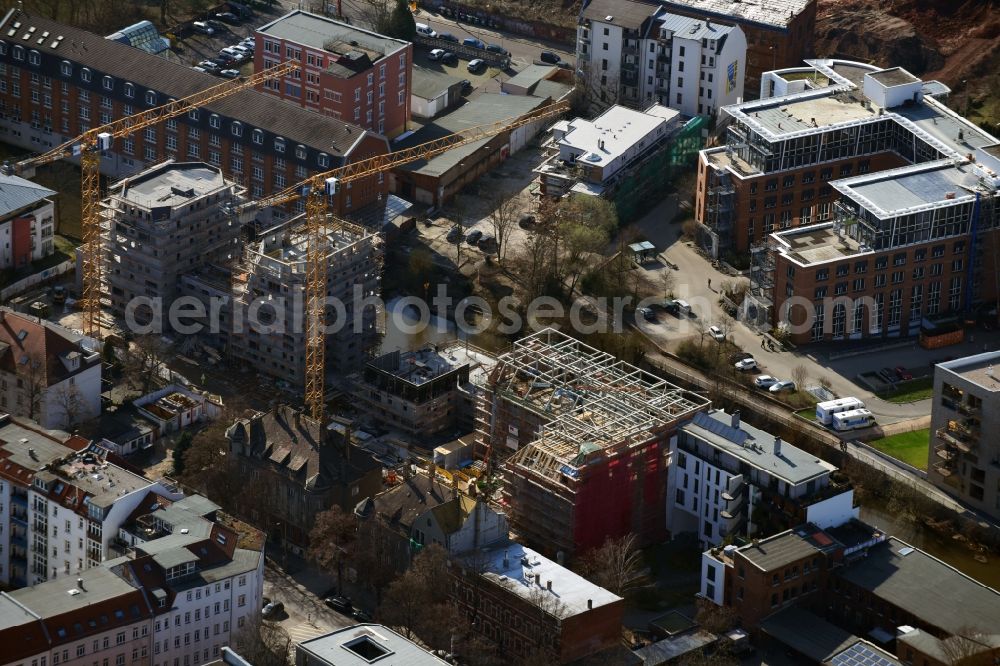 Leipzig from above - Construction site to build a new multi-family residential complex LE RIVERHOUSES on Holbeinstrasse on river Weisse Elster in the district Schleussig in Leipzig in the state Saxony