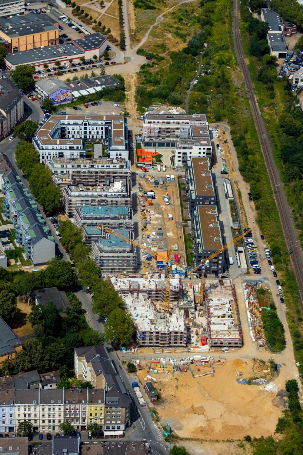 Düsseldorf from the bird's eye view: Construction site to build a new multi-family residential complex Schoeffenhoefe of Vivawest Wohnen GmbH on Mindener Strasse in Duesseldorf in the state North Rhine-Westphalia, Germany
