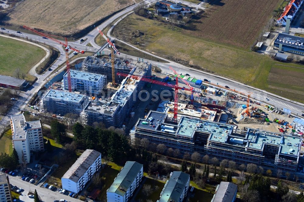Neuried from the bird's eye view: Construction site to build a new multi-family residential complex Suedlage on street Forstenrieder Strasse - Maxhofweg - Zugspitzstrasse in Neuried in the state Bavaria, Germany