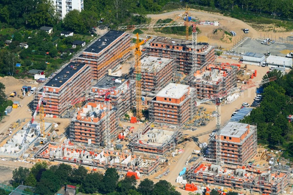 Berlin from the bird's eye view: Construction site to build a new multi-family residential complex Stadtgut on street Alt-Hellersdorf - Havellaender Ring in the district Hellersdorf in Berlin, Germany