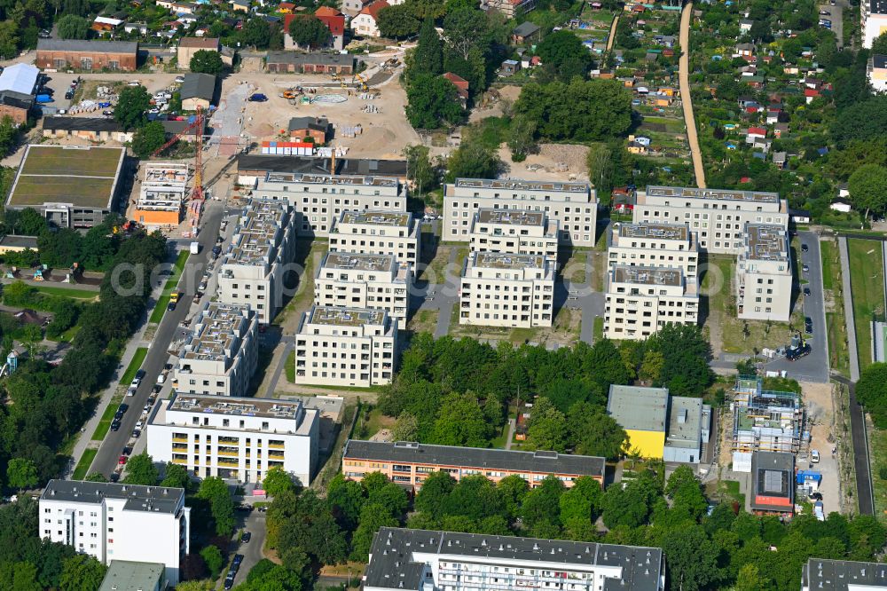 Berlin from the bird's eye view: Construction site to build a new multi-family residential complex Stadtgut on street Alt-Hellersdorf - Havellaender Ring - Eva-Strittmatter-Strasse in the district Hellersdorf in Berlin, Germany
