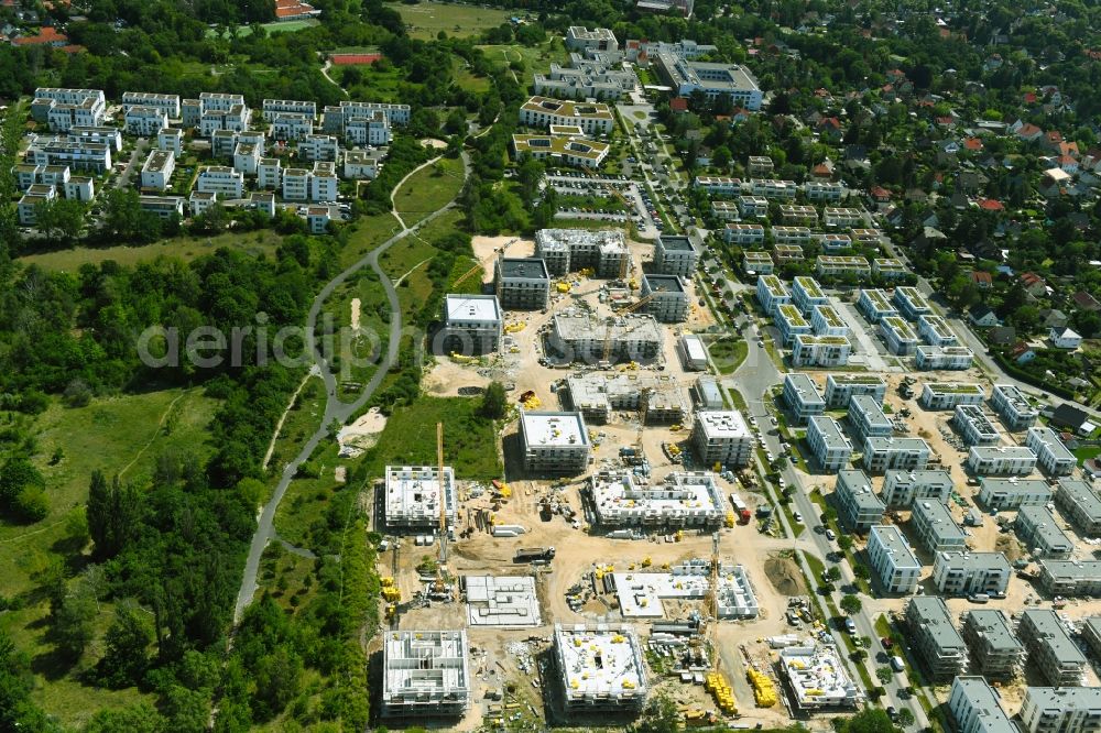 Berlin from the bird's eye view: Construction site to build a new multi-family residential complex on Sternbluetenweg in the district Bohnsdorf in Berlin, Germany