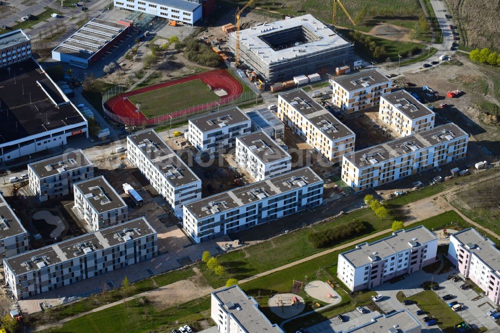 Schönefeld from the bird's eye view: Construction site to build a new multi-family residential complex Theodor-Fontane-Hoefe of DIE Deutsche Immobilien Entwicklungs AG on Theodor-Fontane-Allee in Schoenefeld in the state Brandenburg, Germany