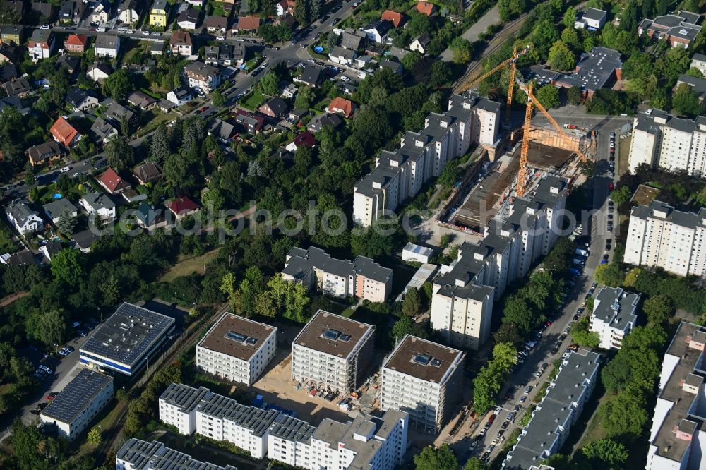 Berlin from the bird's eye view: Construction site to build a new multi-family residential complex Theodor-Loos-Weg corner Wutzkyallee in the district Buckow in Berlin, Germany