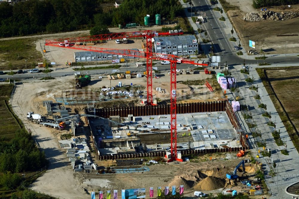 Berlin from the bird's eye view: Construction site to build a new multi-family residential complex of the project Square 1 on Wagner-Regeny-Allee in the district Niederschoeneweide in Berlin, Germany
