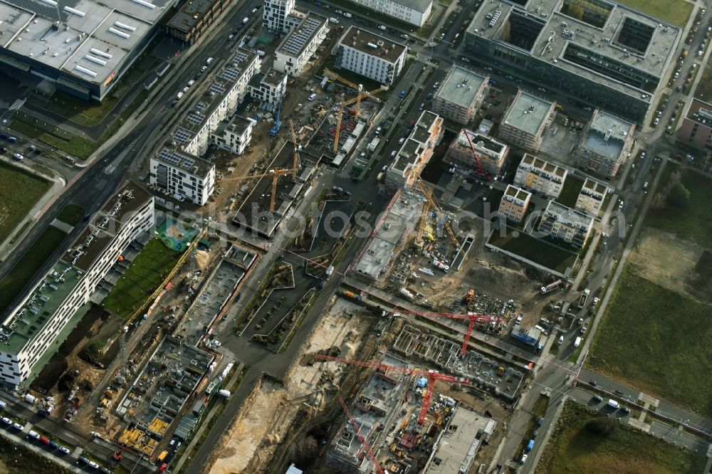 Berlin from the bird's eye view: Construction site to build a new multi-family residential complex „ Wohnen am Campus “ an der Rudower Chaussee in Berlin in Germany