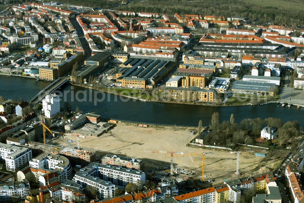 Berlin from above - Construction site for the construction of an apartment building WOHNWERK am Spreeknie by BUWOG Bautraeger GmbH between Spreestrasse, Fliessstrasse and Hasselwerder Strasse in the Schoeneweide district in Berlin, Germany