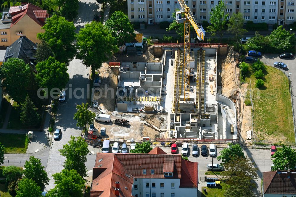 Bernau from the bird's eye view: Construction site to build a new multi-family residential complex on Karl-Marx-Strasse corner Enzianstrasse in Bernau in the state Brandenburg, Germany