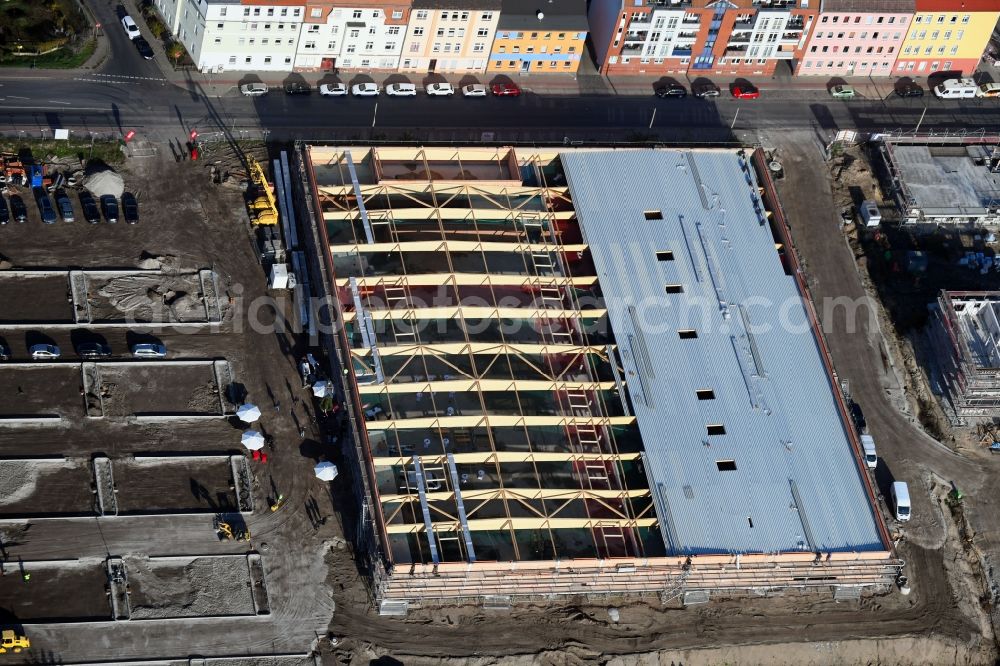 Brandenburg an der Havel from the bird's eye view: Construction site for the new building of apartment houses and a REWE-Center supermarket on Neuendorfer Strasse in Brandenburg an der Havel in the state Brandenburg, Germany