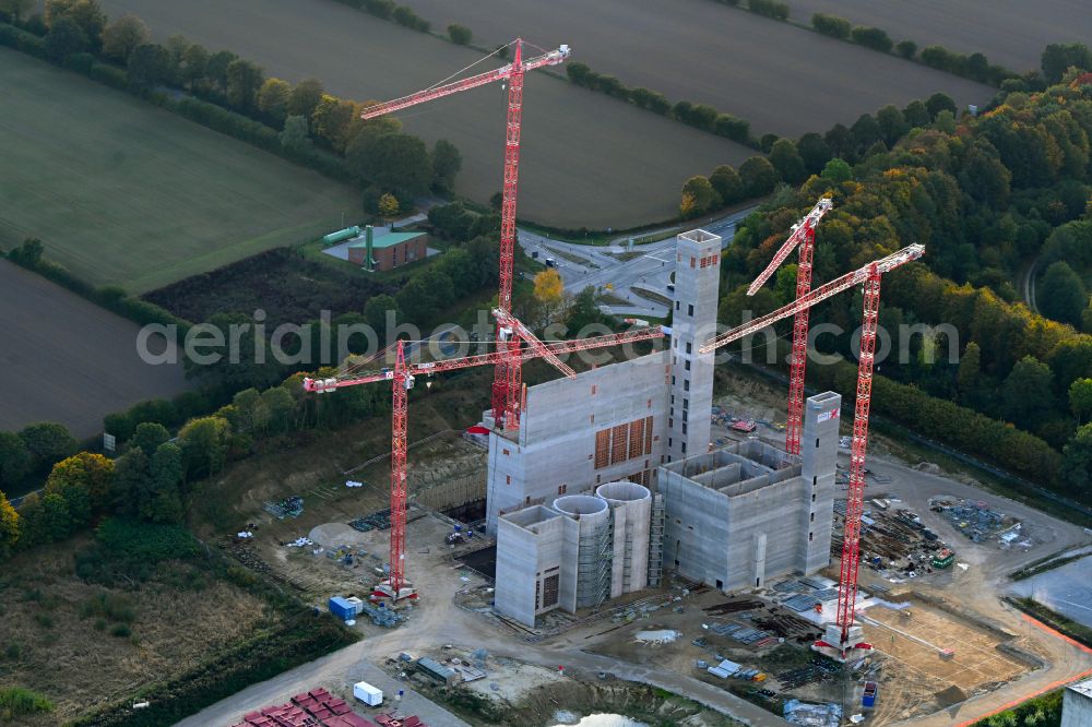 Stapelfeld from the bird's eye view: Construction site for the new construction of the waste incineration plant for waste treatment MVA residual waste combined heat and power plant and a mono sewage sludge incineration on the street Ahrensburger Weg in Stapelfeld in the state Schleswig-Holstein, Germany