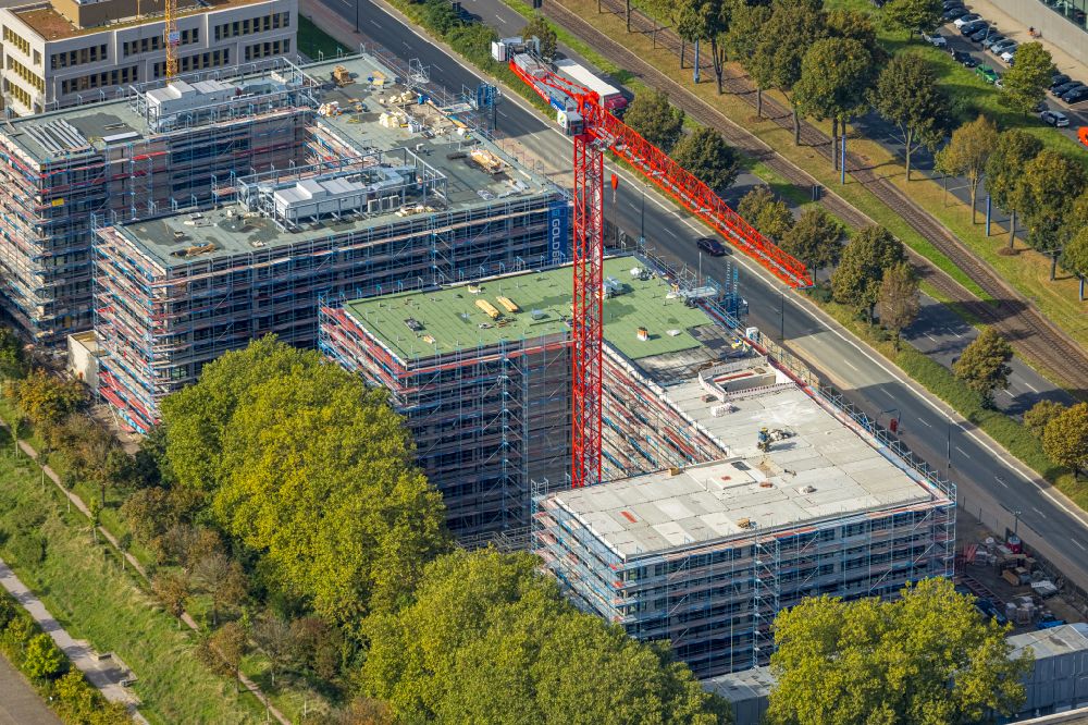 Aerial photograph Dortmund - Construction site for a new building next to the adesso SE building complex on Stockholmer Allee in the district Schueren-Neu in Dortmund in the state North Rhine-Westphalia, Germany