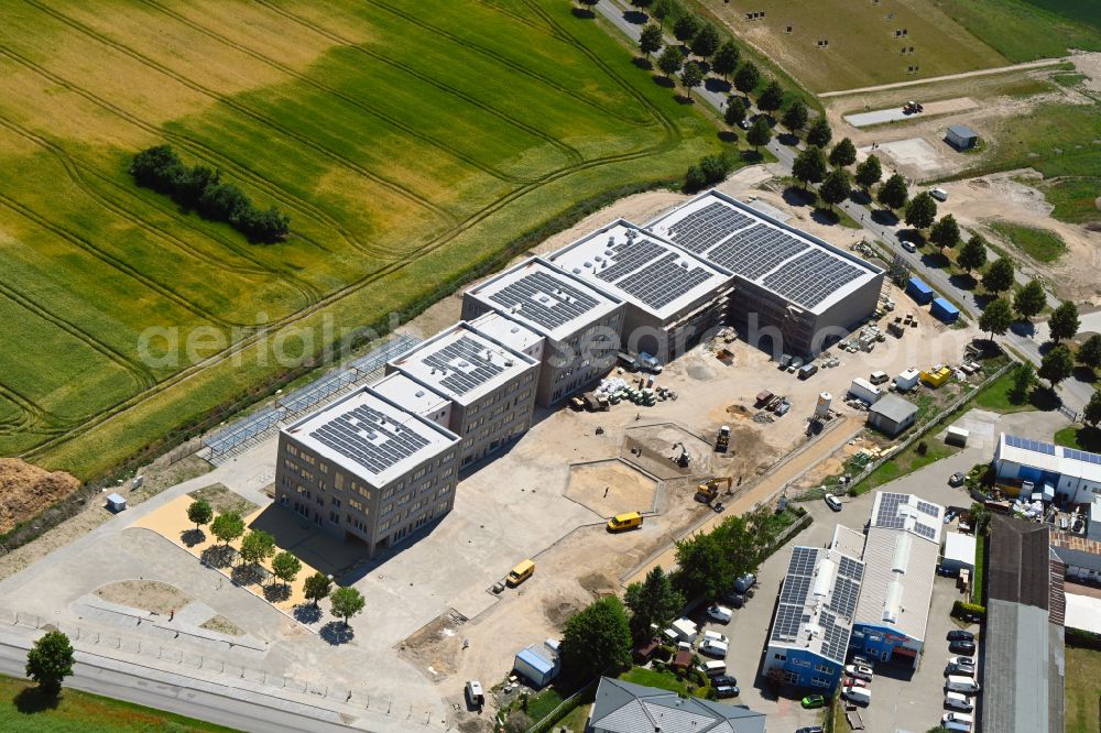 Lindenberg from the bird's eye view: New construction site of the school building between Ahrensfelof Chaussee in Lindenberg in the state Brandenburg, Germany