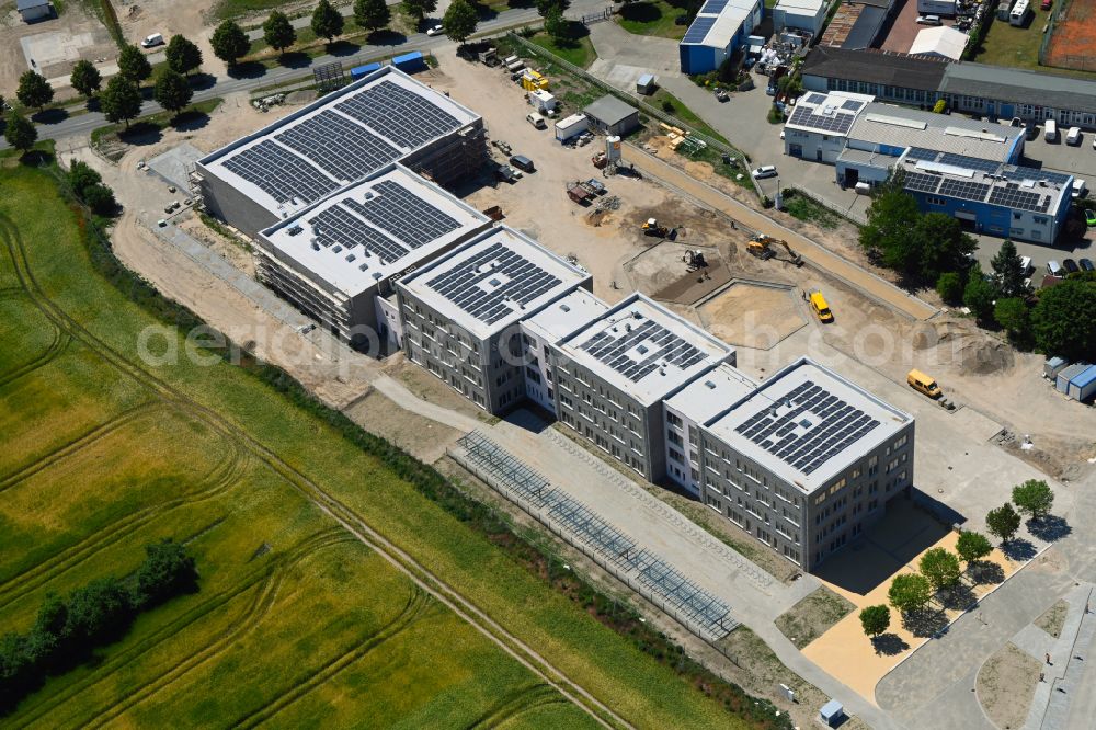 Lindenberg from above - New construction site of the school building between Ahrensfelof Chaussee in Lindenberg in the state Brandenburg, Germany