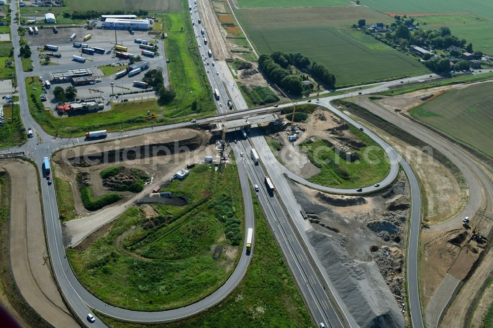 Oberkrämer from the bird's eye view: Construction site for the new construction of the road bridge construction at the motorway exit and access Oberkraemer in the state of Brandenburg, Germany