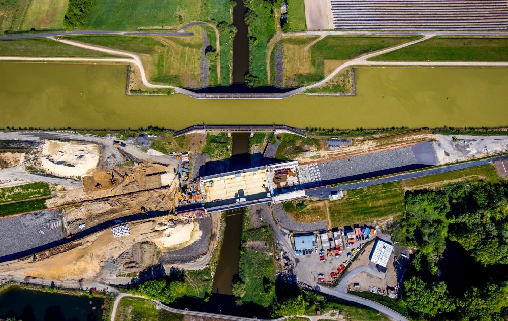 Greven from the bird's eye view: Construction of road bridge of canal bypass between Gittruper Strasse and Fuestruper Strasse in Greven in the state North Rhine-Westphalia, Germany