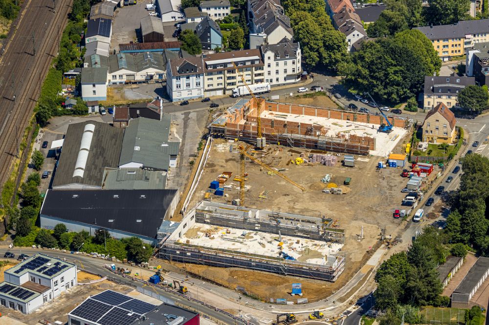 Schwelm from the bird's eye view: Construction site for the new building of a store of the supermarket Aldi and Lidl on street Doeinghauser Strasse in Schwelm in the state North Rhine-Westphalia, Germany