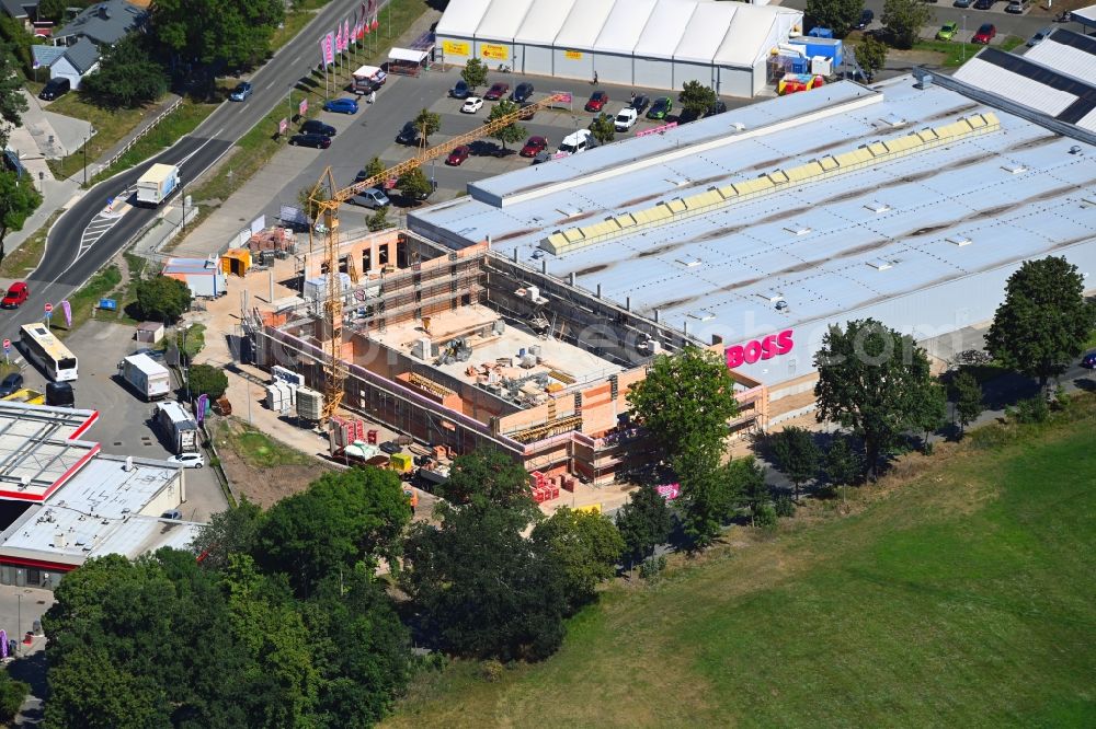 Bernau from the bird's eye view: Construction site for the new building of a store of the supermarket of Netto Marken-Discount AG & Co. KG after the previous demolition by Hagedorn GmbH on Ruednitzer Chaussee in Bernau in the state Brandenburg, Germany