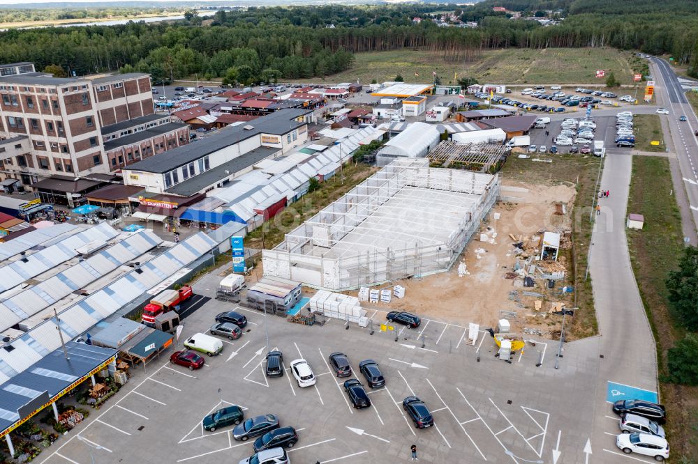 Niederwutzen from above - Construction site for the new building of a store of the supermarket in Niederwutzen in Woiwodschaft Westpommern, Poland