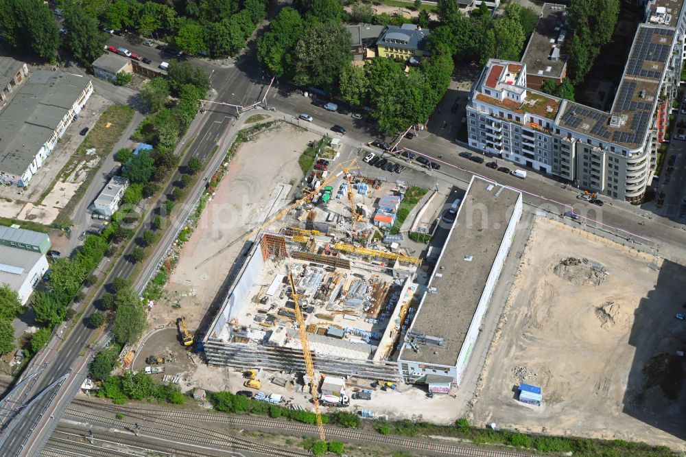 Aerial photograph Berlin - Construction site for the new building of a store of the supermarket REWE on street Revaler Strasse in the district Friedrichshain in Berlin, Germany