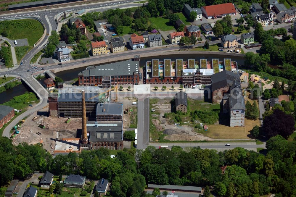 Flöha from the bird's eye view: Construction site for the new construction of the building complex to a shopping center on the site of the Old Cotton on the Claussstrasse in Floeha in the state of Saxony, Germany