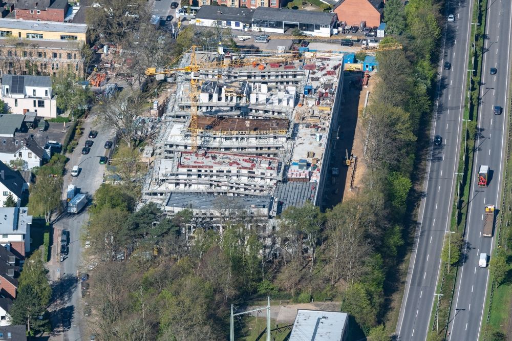 Aerial photograph Hamburg - Construction site for the construction of a multi-family residential and commercial building ensemble on the Alte Suelldorfer Landstrasse in the Rissen district in Hamburg, Germany