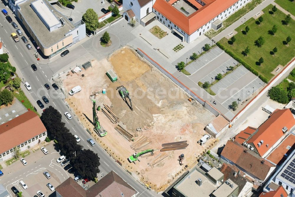 Dillingen an der Donau from the bird's eye view: Construction site for the new residential and commercial building of VR-Bank Donau-Mindel on Kapuzinerstrasse in Dillingen an der Donau in the state Bavaria, Germany