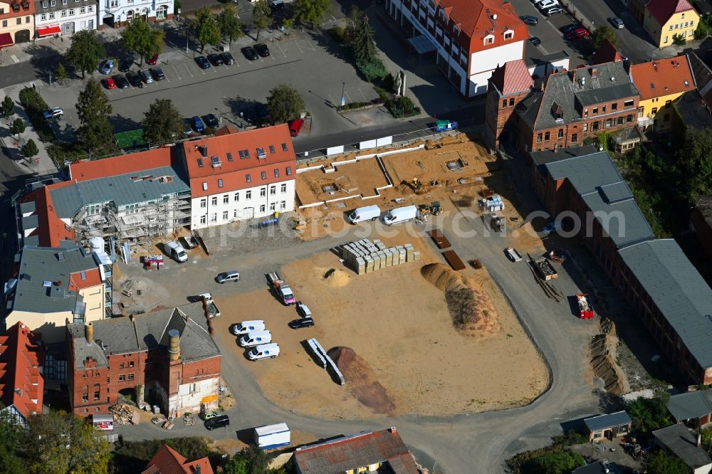 Burg from above - Construction site for the new residential and commercial building on Bruederstrasse in Burg in the state Saxony-Anhalt, Germany